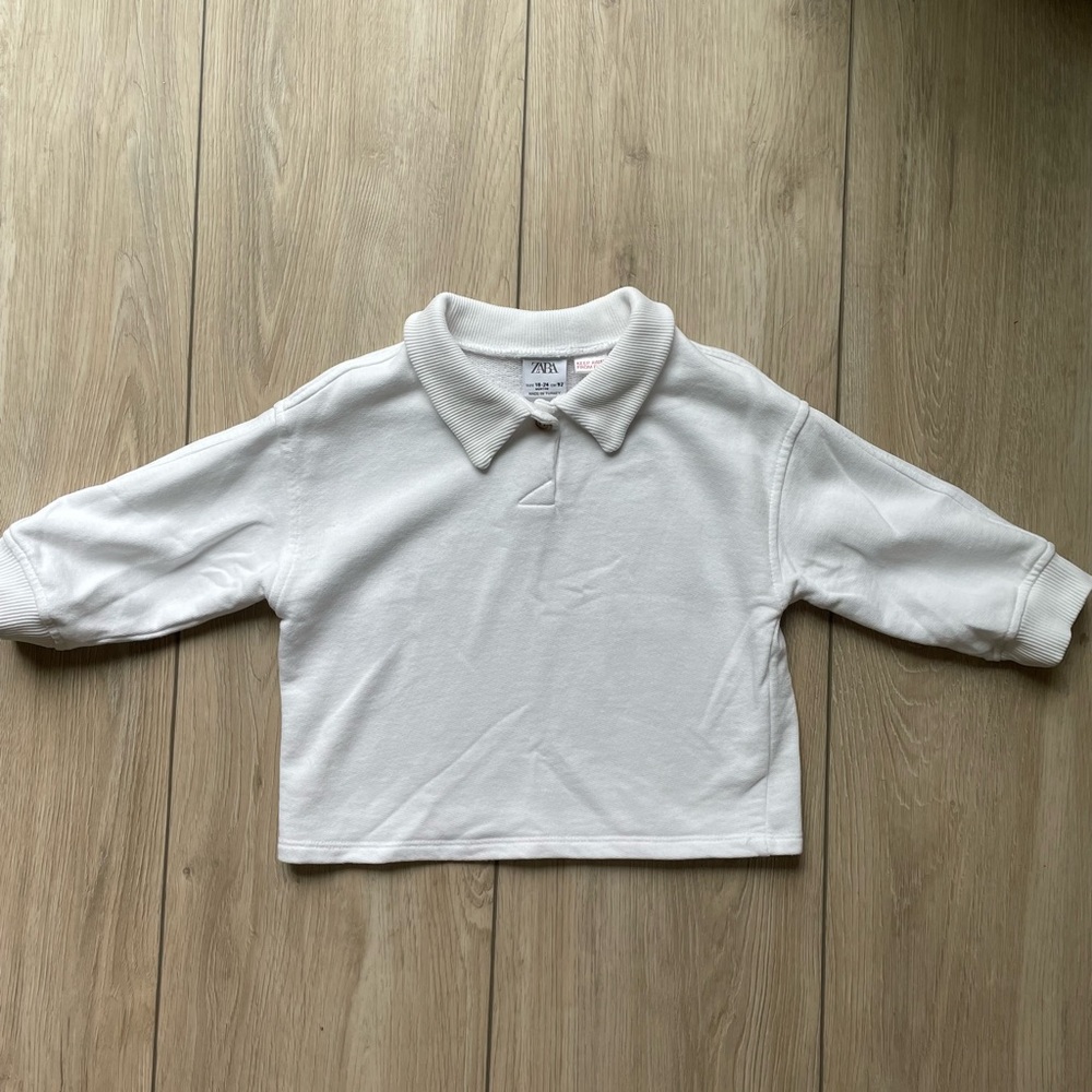 White collared sweater